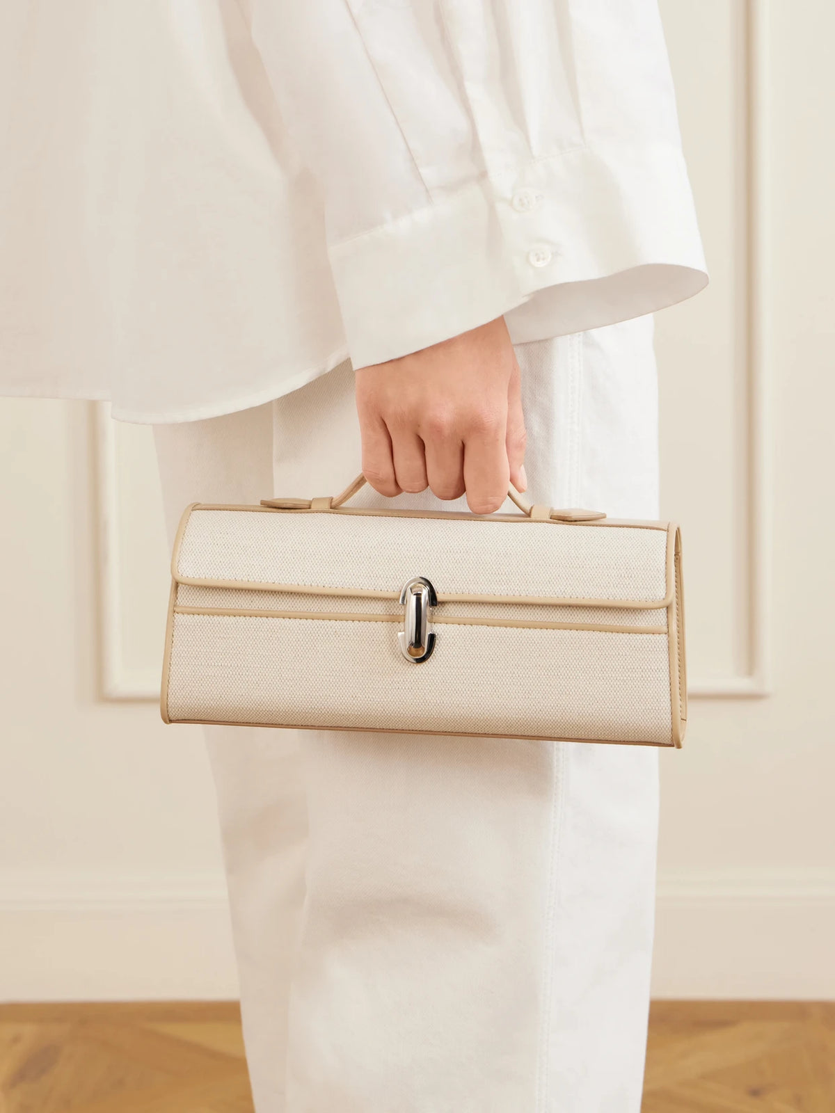 Image of Bags. Product name - Slim Symmetry Canvas Leather-trimmed Clutch in Ecru colour by brand - Savette