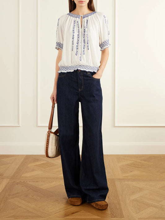 Image of a model wearing Tops. Product name - Shirred Embroidered Cotton And Linen-blend Woven Blouse in White colour by brand - RRL