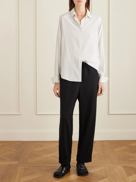 Image of a model wearing Tops. Product name - Fiora Pinstriped Silk Shirt in Multi colour by brand - The Row