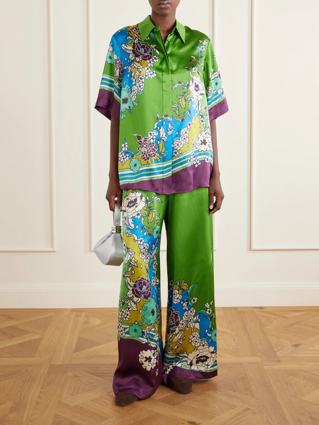 Image of a model wearing Tops. Product name - Nanci Printed Silk-satin Shirt in Green colour by brand - ALÉMAIS
