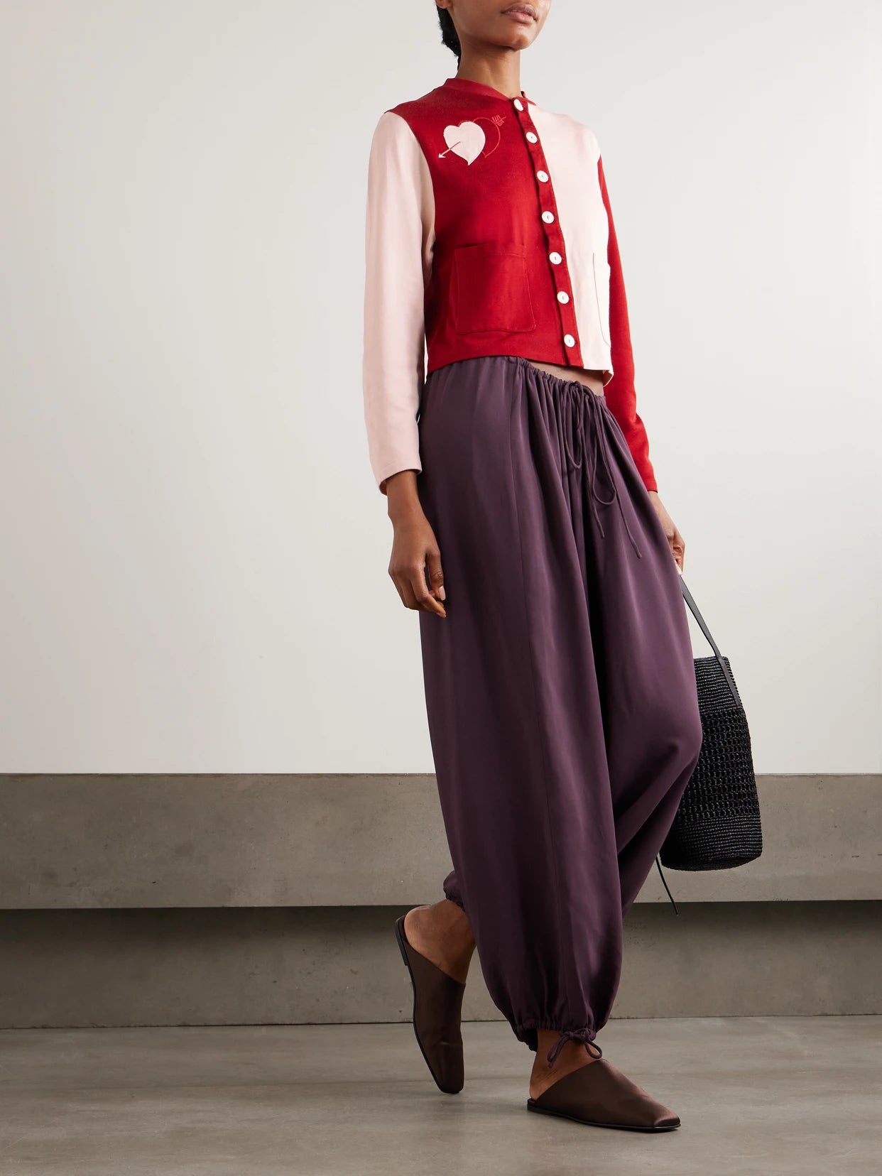 Image of a model wearing Outerwear. Product name - Wonderland Embroidered Knitted Cardigan in small colour by brand - BODE