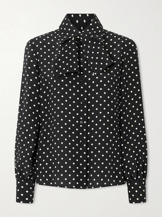 Image of a model wearing Tops. Product name - Tie-detailed Polka-dot Silk Crepe De Chine Shirt in Black colour by brand - Valentino Garavani