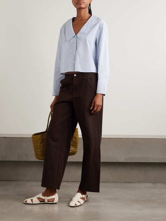 Image of a model wearing Tops. Product name - Striped Organic Cotton Shirt in Blue colour by brand - Deiji Studios