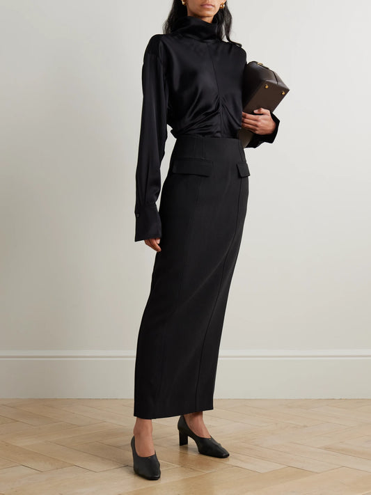 Image of a model wearing Skirts. Product name - Grain De Poudre Maxi Skirt in Black colour by brand - TOTEME