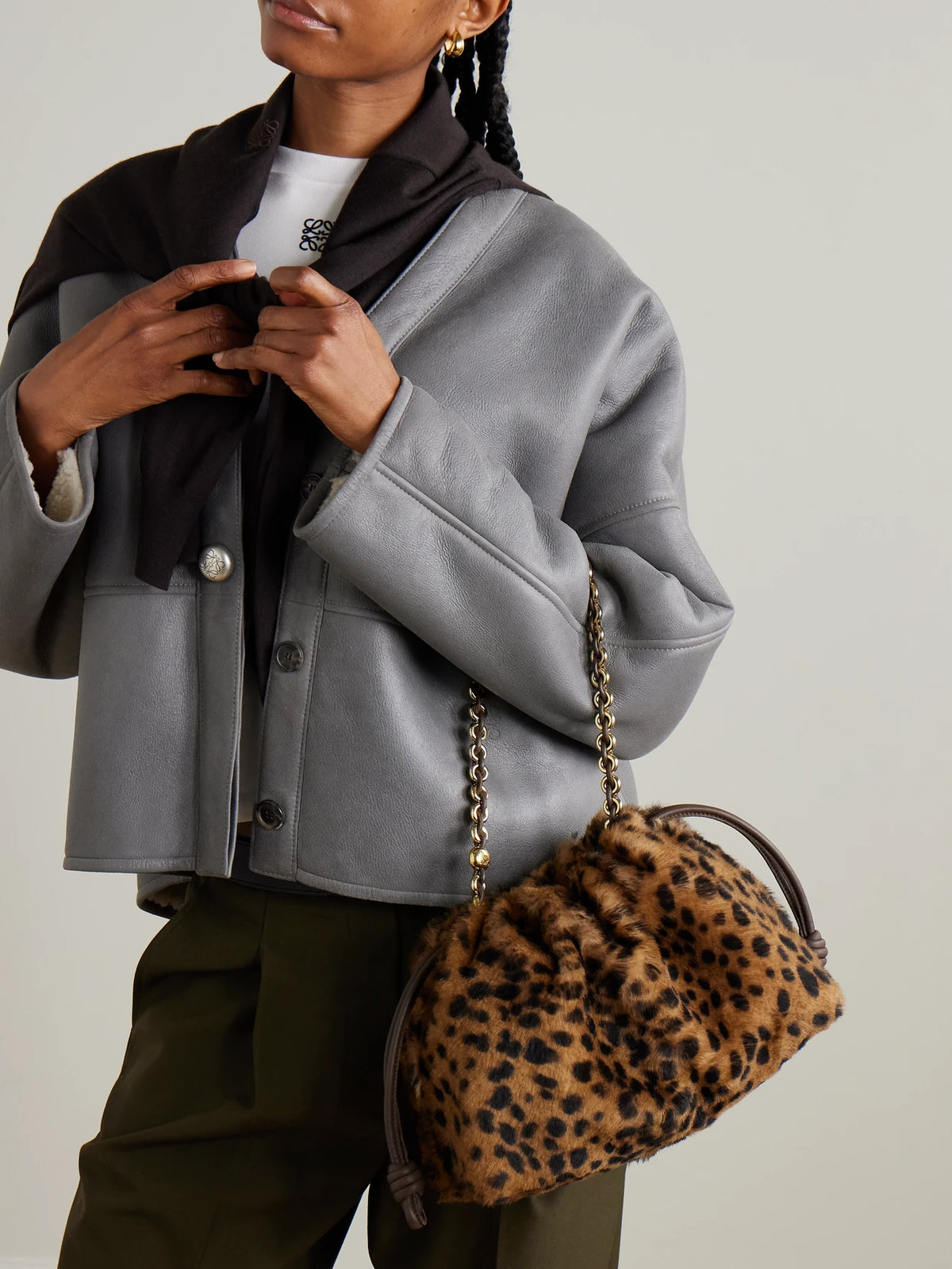Image of Bags. Product name - Flamenco Medium Leather-trimmed Leopard-print Shearling Clutch in Leopard print colour by brand - LOEWE