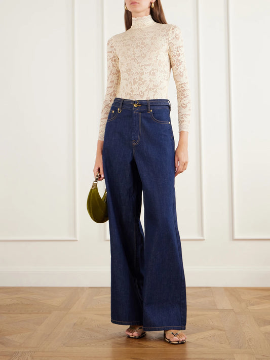 Image of a model wearing Tops. Product name - Corded Lace Turtleneck Bodysuit in Cream colour by brand - Zimmermann