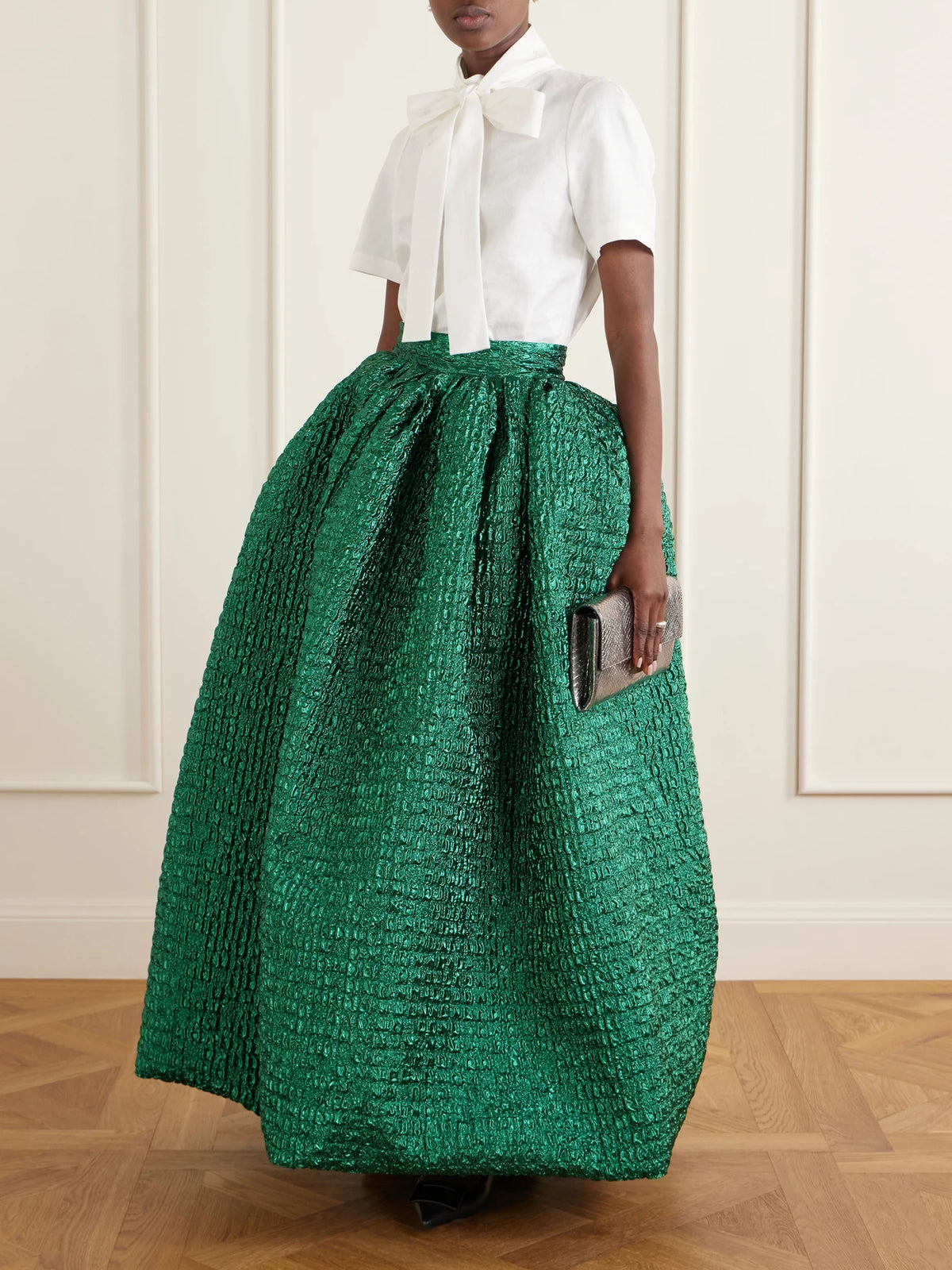 Image of a model wearing Skirts. Product name - Cloqué Maxi Skirt in Forest green colour by brand - Dima Ayad