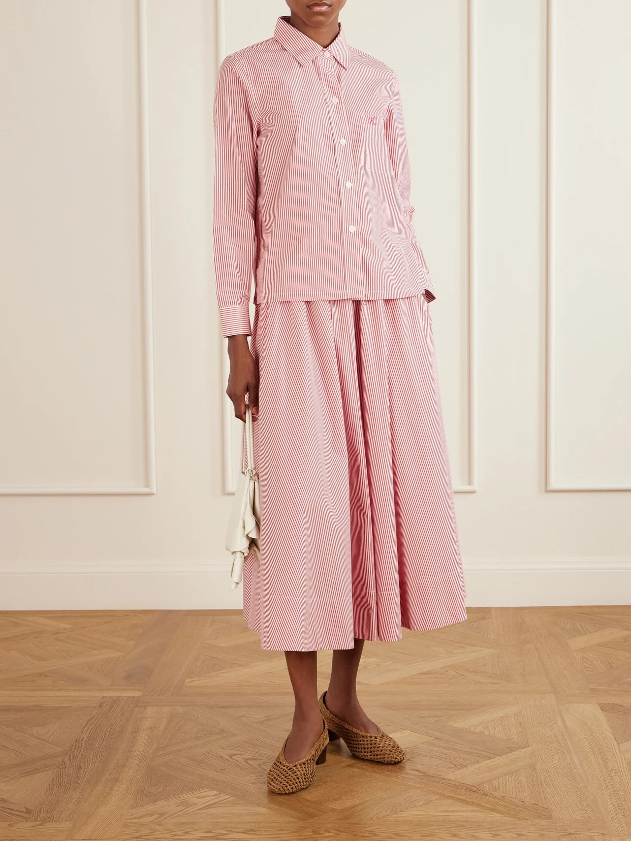 Image of a model wearing Tops. Product name - Vella Logo-embroidered Striped Cotton-poplin Shirt in small colour by brand - Suzie Kondi