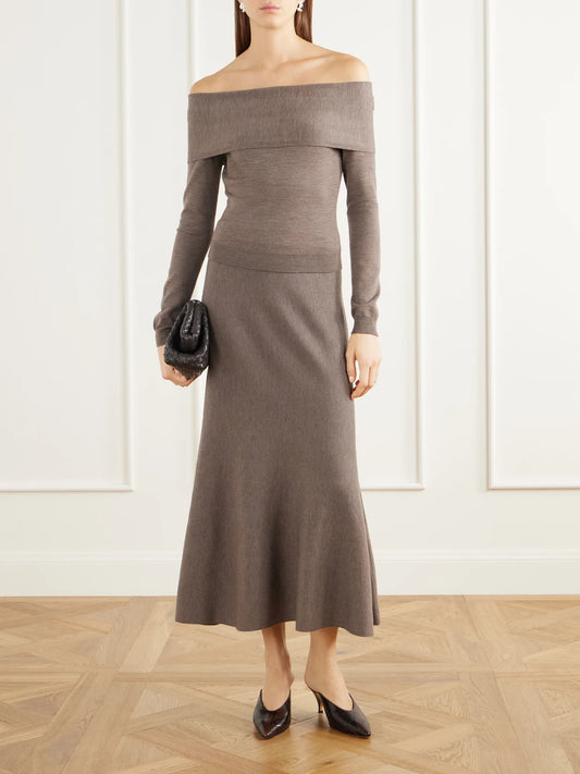 Image of a model wearing Tops. Product name - Delphia Off-the-shoulder Mélange Merino Wool Sweater in Brown colour by brand - SIMKHAI