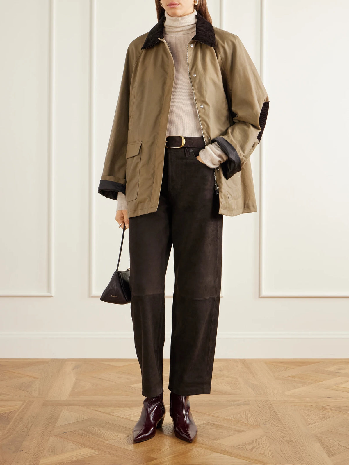Image of a model wearing Pants. Product name - Miro Paneled Suede Mid-rise Barrel-leg Pants in Chocolate colour by brand - Citizens of Humanity