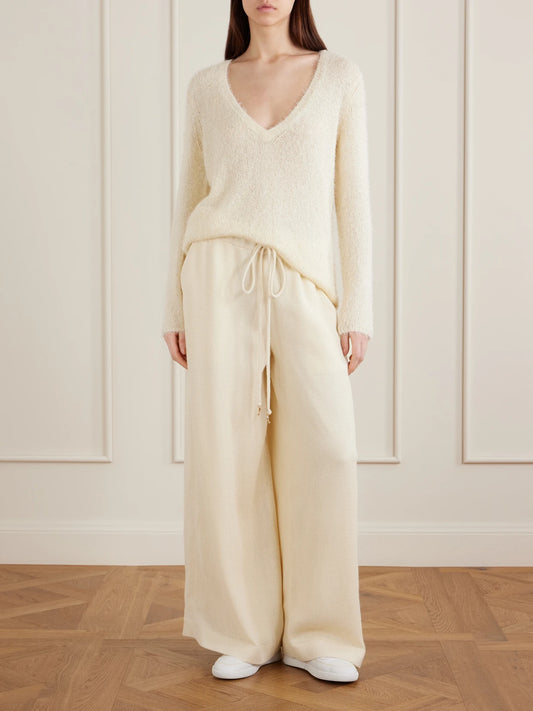 Image of a model wearing Outerwear. Product name - Neoma Silk And Cashmere-blend Sweater in Off-white colour by brand - Gabriela Hearst