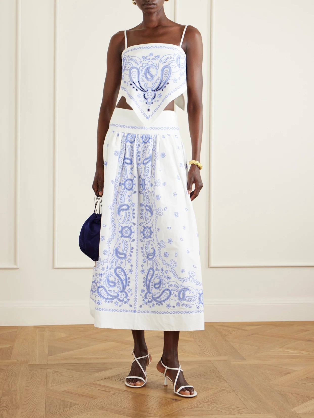 Image of a model wearing Skirts. Product name - Tiered Embroidered Cotton-poplin Midi Skirt in White colour by brand - Self-Portrait