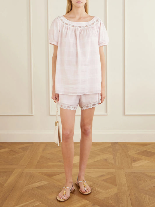 Image of a model wearing Shorts. Product name - Marilyn Lace-trimmed Checked Cotton Shorts in Pink colour by brand - Posse
