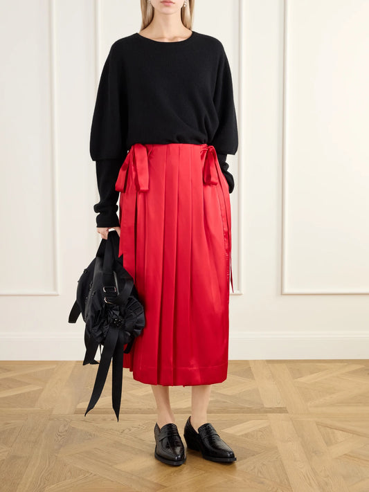 Image of a model wearing Skirts. Product name - Pleated Sheer Satin Midi Skirt in Red colour by brand - Simone Rocha