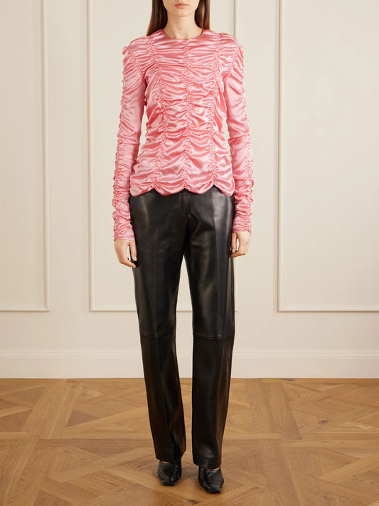 Image of a model wearing Tops. Product name - Rory Ruched Silk Satin Top in Pink colour by brand - KHAITE