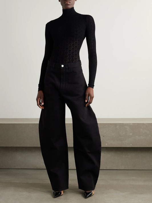 Image of a model wearing Tops. Product name - Open-knit Turtleneck Bodysuit in Black colour by brand - Alaïa