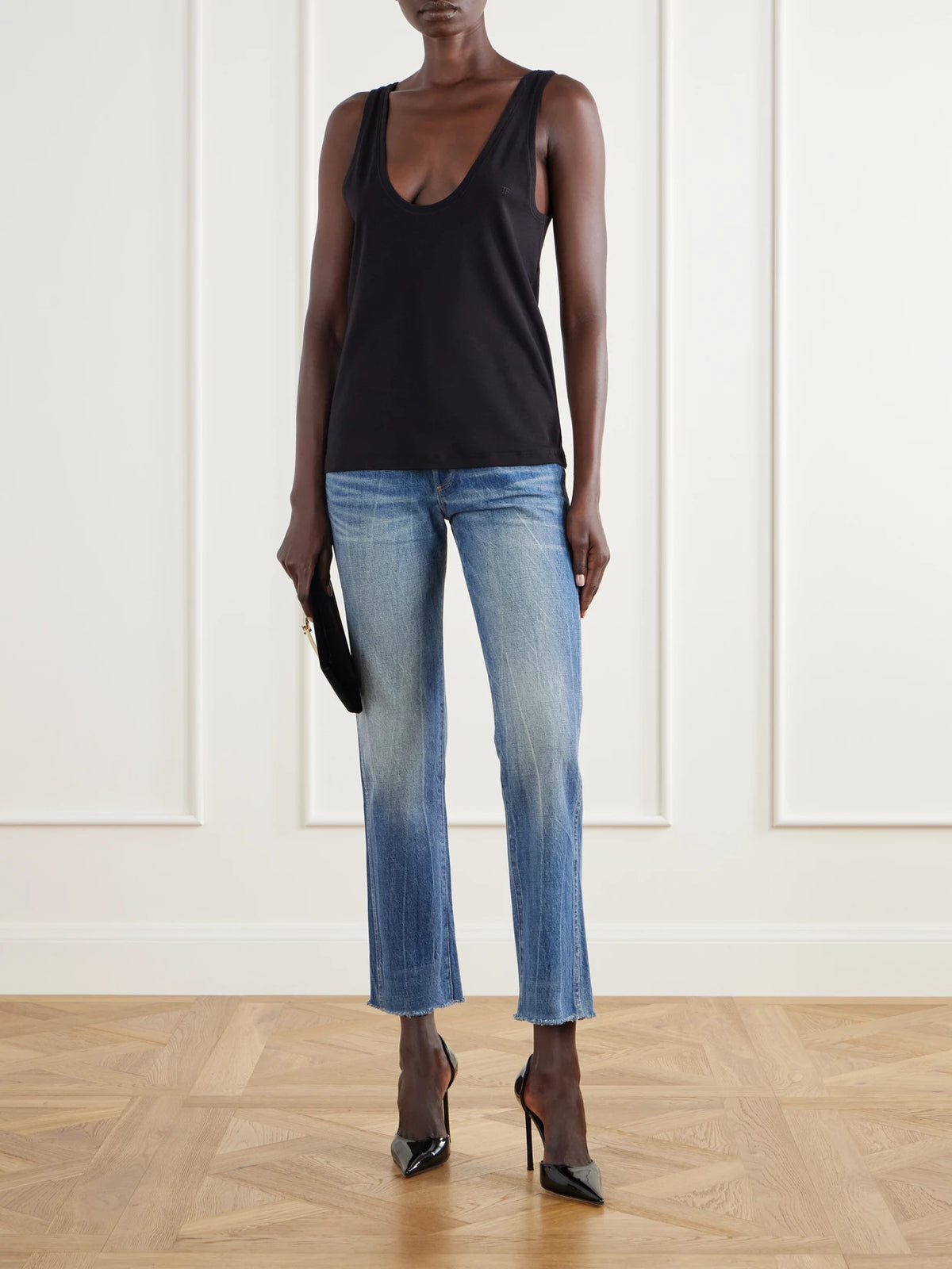 Image of a model wearing Tops. Product name - Ribbed Stretch-cotton Jersey Tank in Black colour by brand - TOM FORD