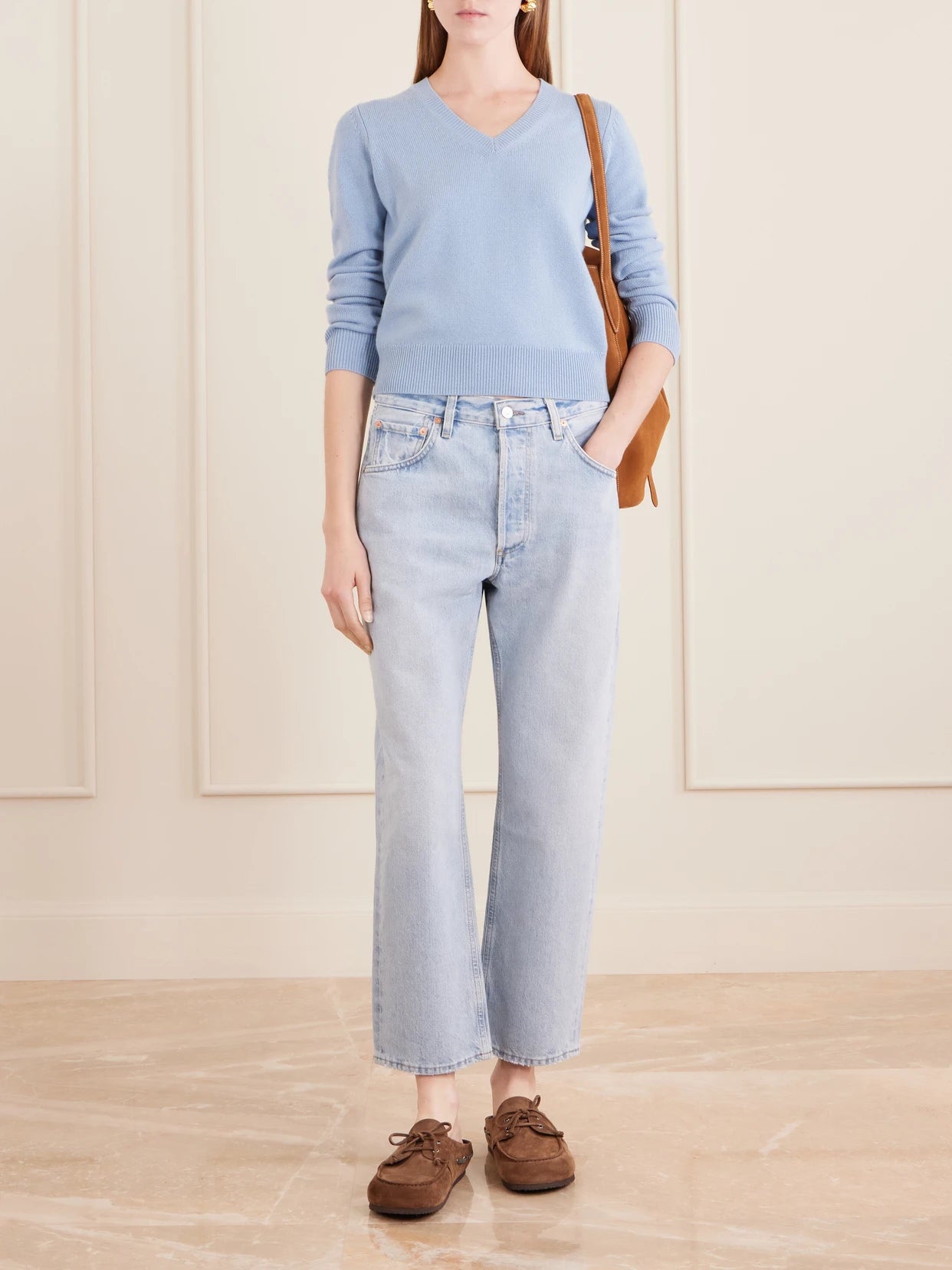 Image of a model wearing Outerwear. Product name - Camelia Knitted Cashmere Sweater in Light blue colour by brand - Nili Lotan
