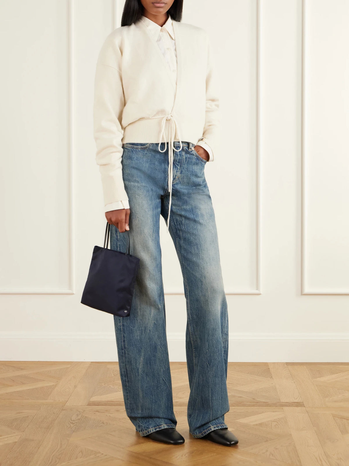 Image of a model wearing Outerwear. Product name - Ella Tie-detail Cashmere-blend Cardigan in Cream, Sage green colour by brand - Extreme Cashmere