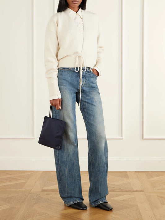 Image of a model wearing Outerwear. Product name - Ella Tie-detail Cashmere-blend Cardigan in Cream, Sage green colour by brand - Extreme Cashmere