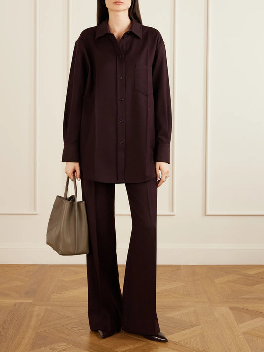 Image of a model wearing Tops. Product name - Remi Wool Shirt in Burgundy colour by brand - Victoria Beckham