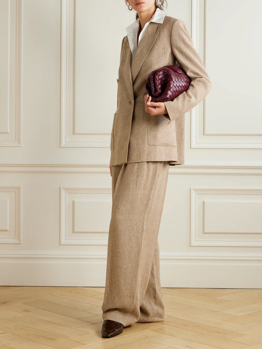 Image of a model wearing Outerwear. Product name - Double-breasted Linen Blazer in Brown colour by brand - Loro Piana