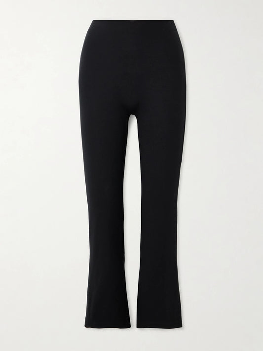 Image of a model wearing Pants. Product name - Rio Cropped Stretch-ponte Flared Pants in Black colour by brand - LESET