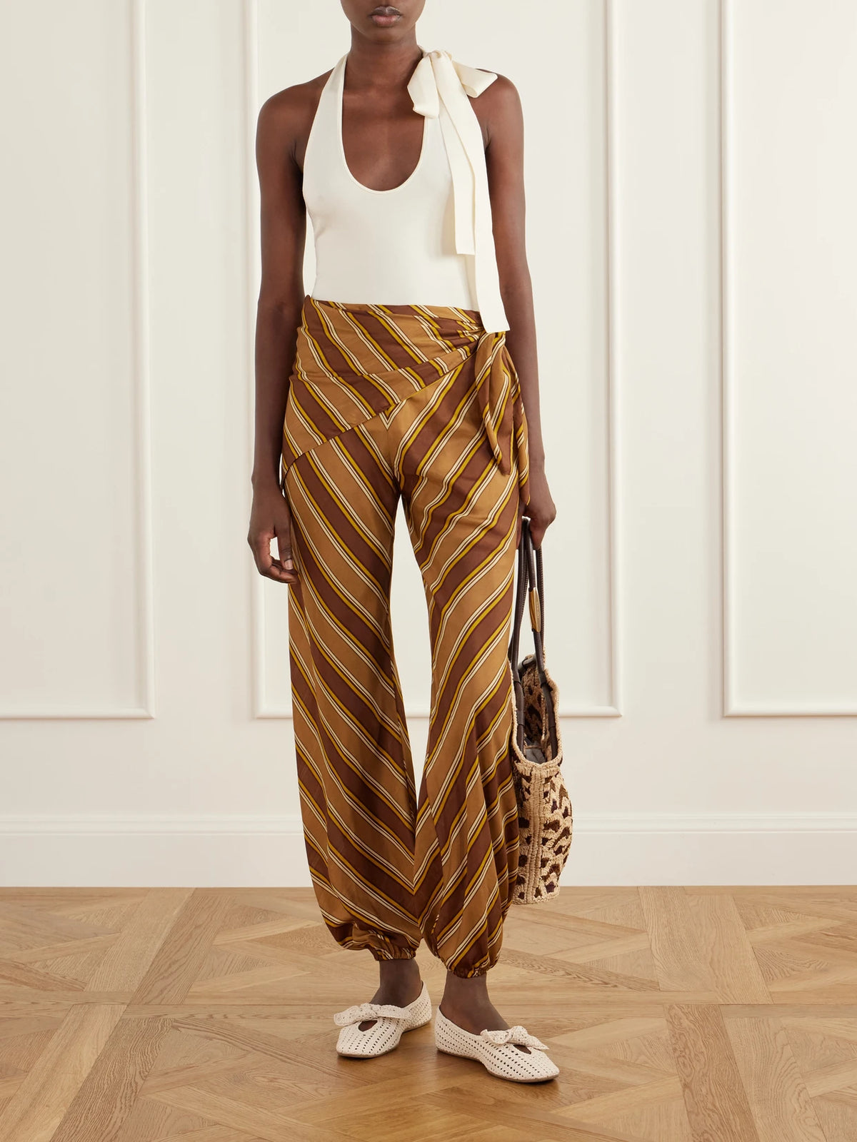 Image of a model wearing Tops. Product name - Fairlight Jersey Halterneck Top in Cream, Chocolate colour by brand - Zimmermann