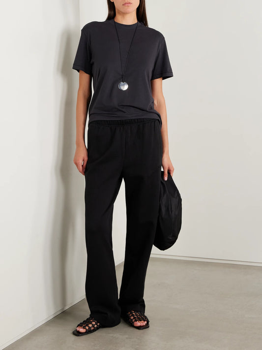 Image of Sleepwear & Loungewear. Product name - Classic Cotton-blend Jersey Straight-leg Pants - Onyx in Black colour by brand - SKIMS