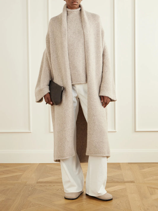 Image of a model wearing Outerwear. Product name - Alpaca-blend Cardigan in Beige colour by brand - Lauren Manoogian