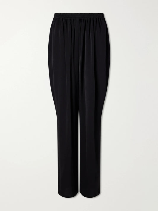 Image of a model wearing Pants. Product name - Striped Cady Straight-leg Pants in Black colour by brand - Alaïa
