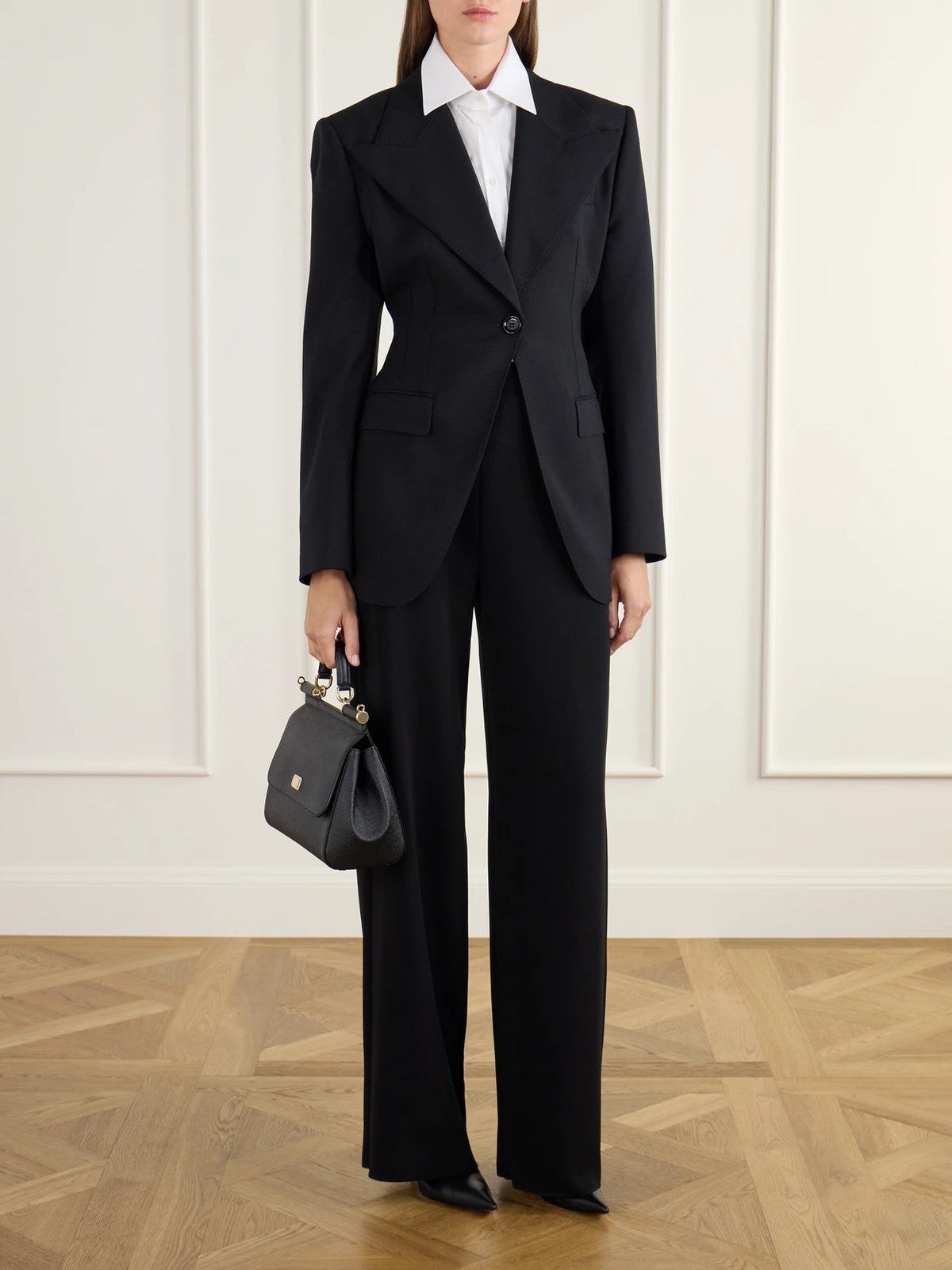 Image of a model wearing Outerwear. Product name - Darted Wool-blend Gabardine Blazer in Black colour by brand - Dolce & Gabbana