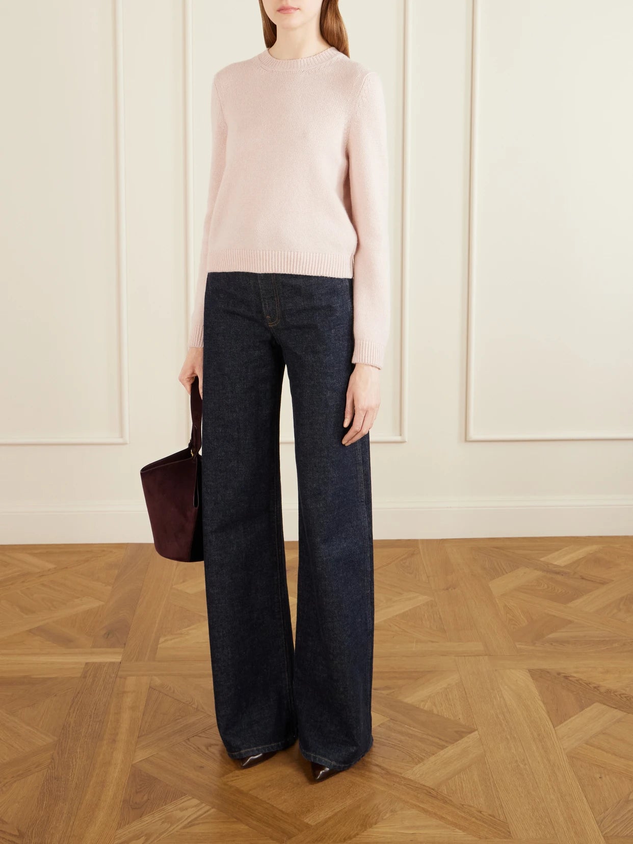 Image of a model wearing Outerwear. Product name - Leta Cashmere Sweater in Pastel pink colour by brand - KHAITE