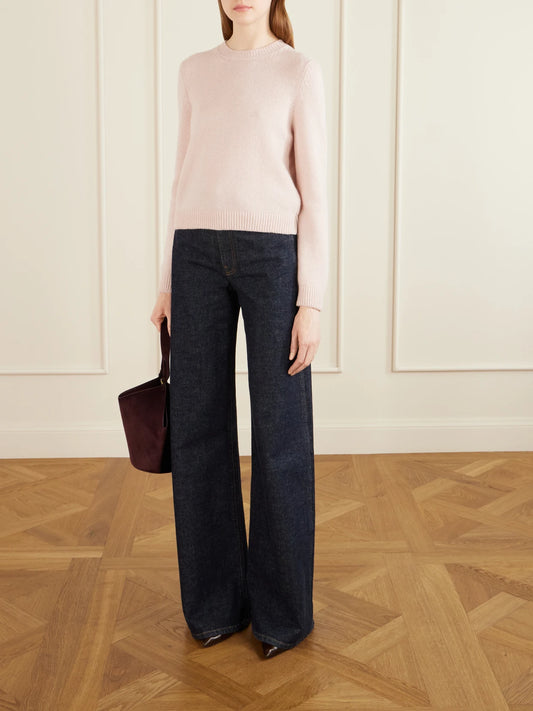 Image of a model wearing Outerwear. Product name - Leta Cashmere Sweater in Pastel pink colour by brand - KHAITE