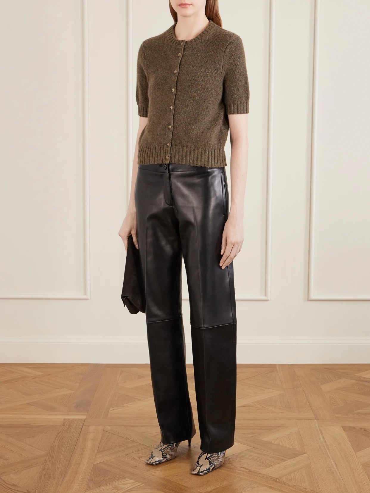Image of a model wearing Outerwear. Product name - Nora Cashmere Cardigan in Army green colour by brand - KHAITE