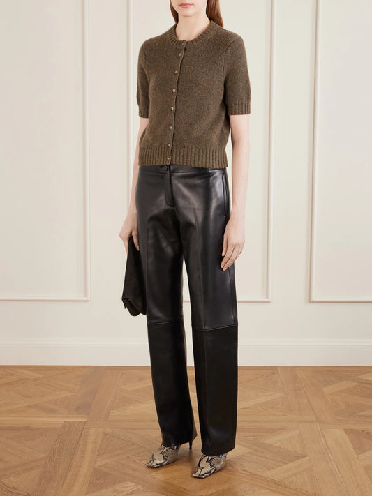 Image of a model wearing Outerwear. Product name - Nora Cashmere Cardigan in Army green colour by brand - KHAITE