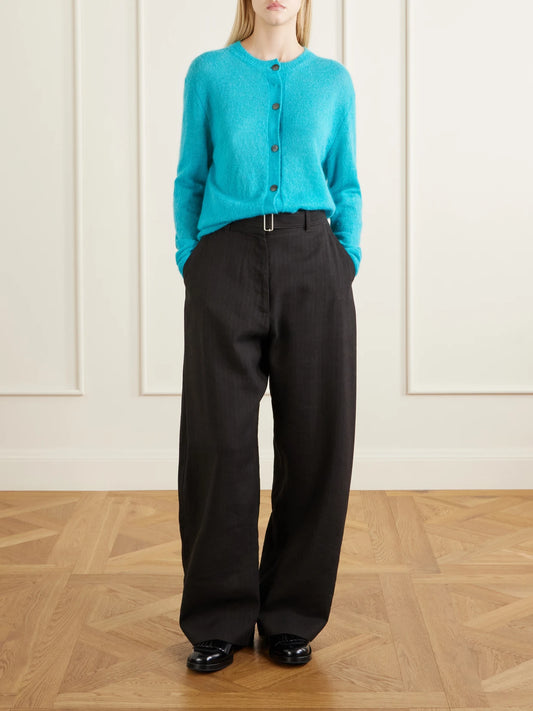 Image of a model wearing Pants. Product name - Chatto Belted Herringbone Cotton And Linen-blend Wide-leg Pants in Black colour by brand - Studio Nicholson