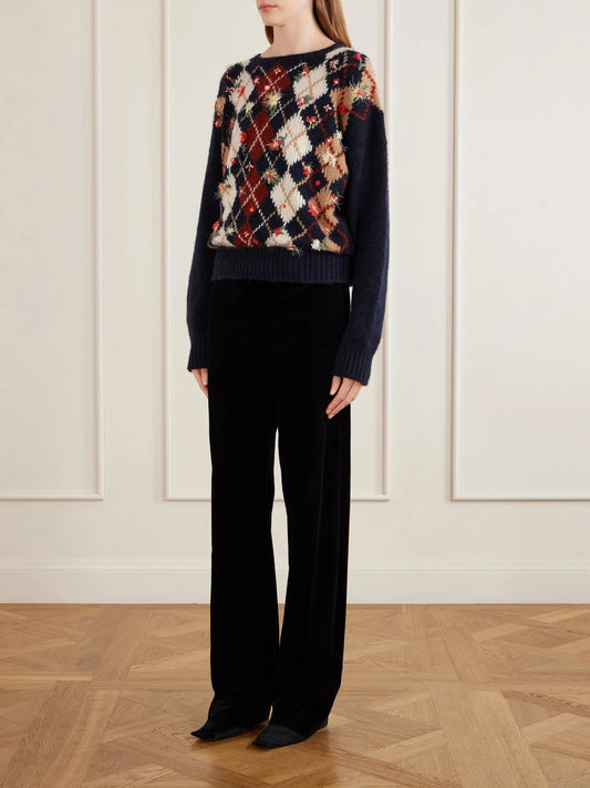 Image of a model wearing Outerwear. Product name - Timi Floral-embroidered Argyle Cashmere And Mohair-blend Sweater in Navy colour by brand - KHAITE