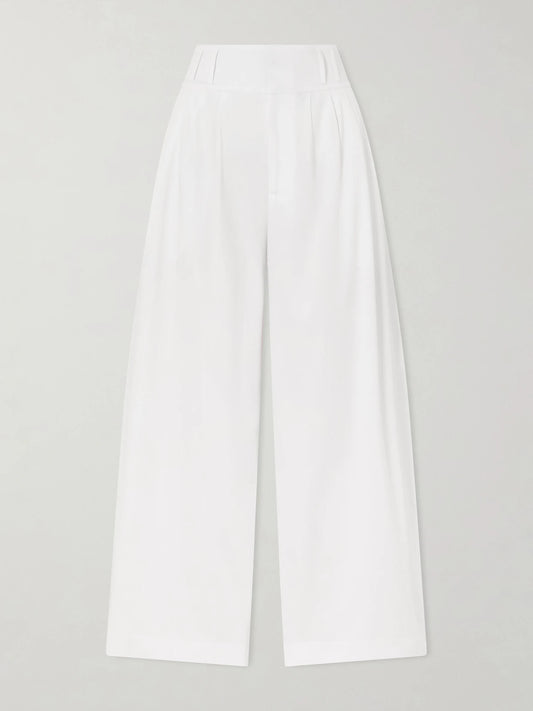 Image of a model wearing Pants. Product name - Wilson Pleated Cotton Wide-leg Pants in White colour by brand - Altuzarra