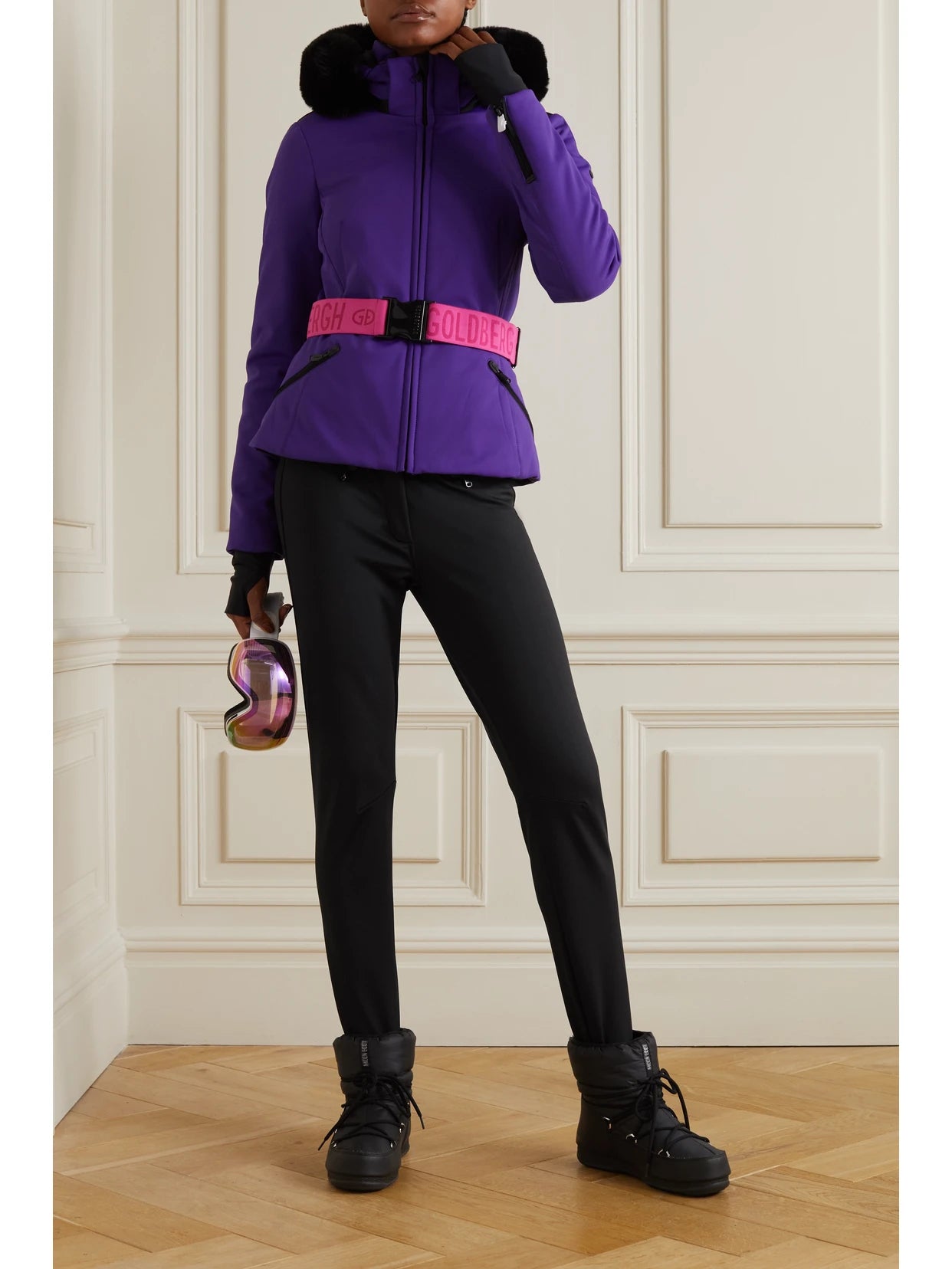 Image of a model wearing Pants. Product name - Paris Belted Stirrup Ski Pants in Black colour by brand - Goldbergh