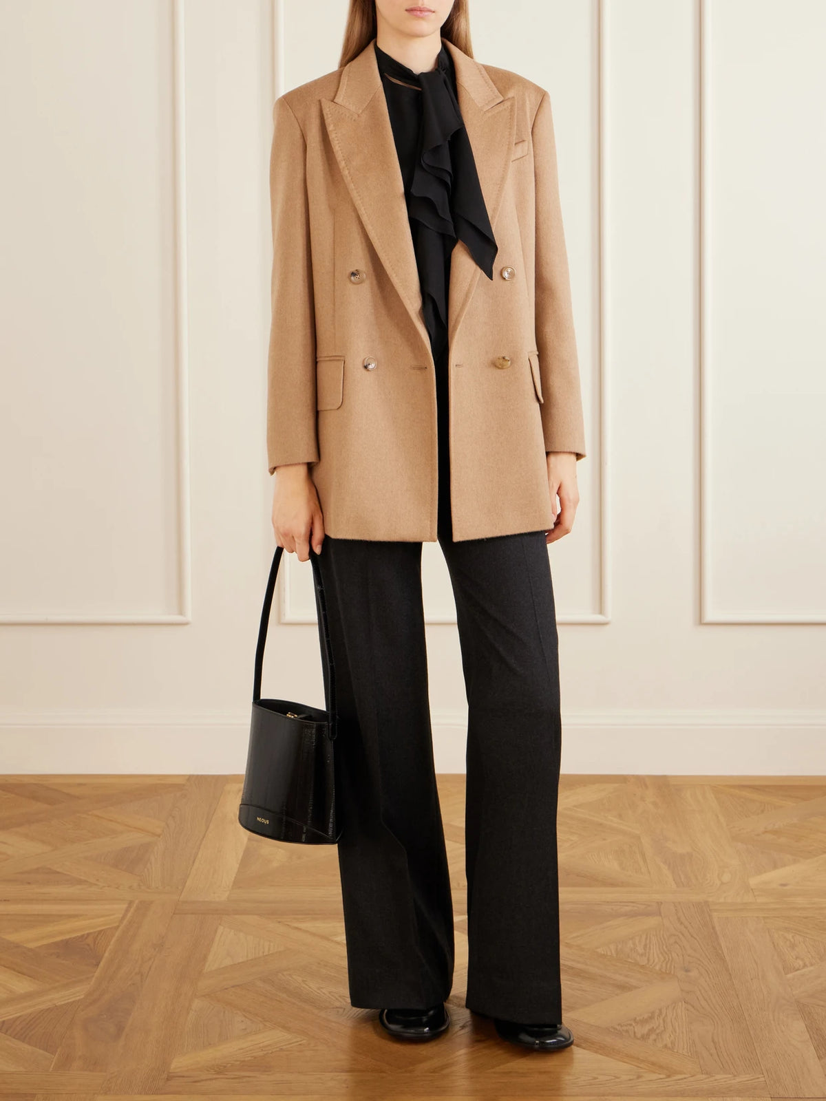 Image of a model wearing Tops. Product name - Leccio Bow-detail Silk-crepon Blouse in Black colour by brand - Max Mara