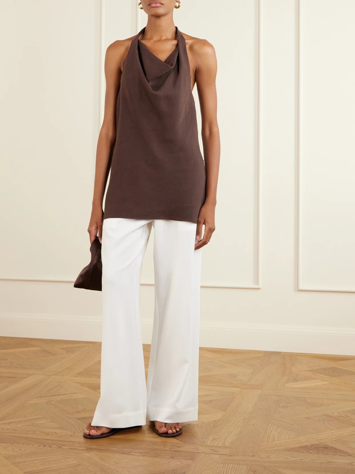 Image of a model wearing Pants. Product name - Arielle Crepe Wide-leg Pants in White colour by brand - LESET