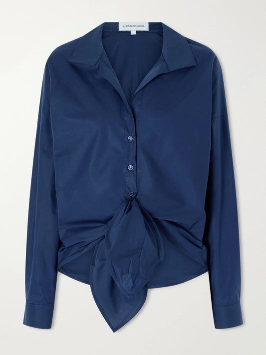 Image of a model wearing Tops. Product name - Dalila Knotted Cotton-poplin Blouse in Navy colour by brand - Andres Otalora