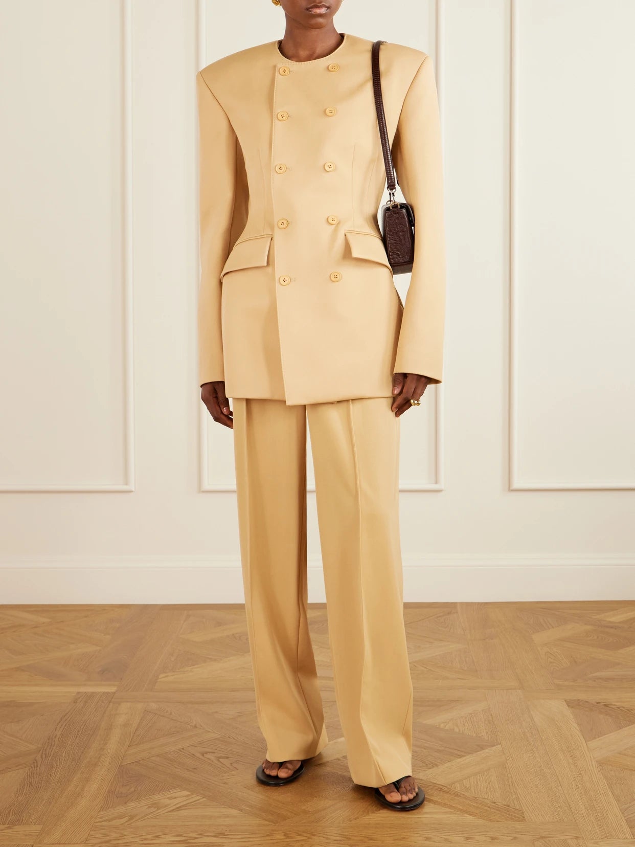 Image of a model wearing Pants. Product name - + Rhw Wool Pants in Beige colour by brand - WARDROBE. NYC