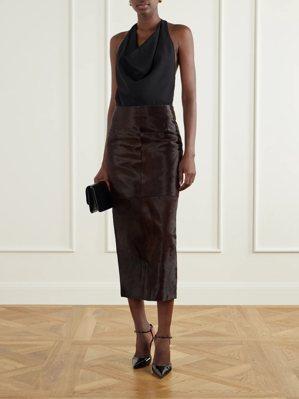 Image of a model wearing Skirts. Product name - Elyse Paneled Calf Hair Midi Skirt in Bronze colour by brand - Nour Hammour