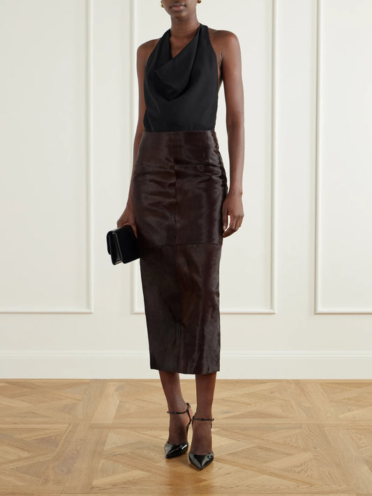 Image of a model wearing Skirts. Product name - Elyse Paneled Calf Hair Midi Skirt in Bronze colour by brand - Nour Hammour