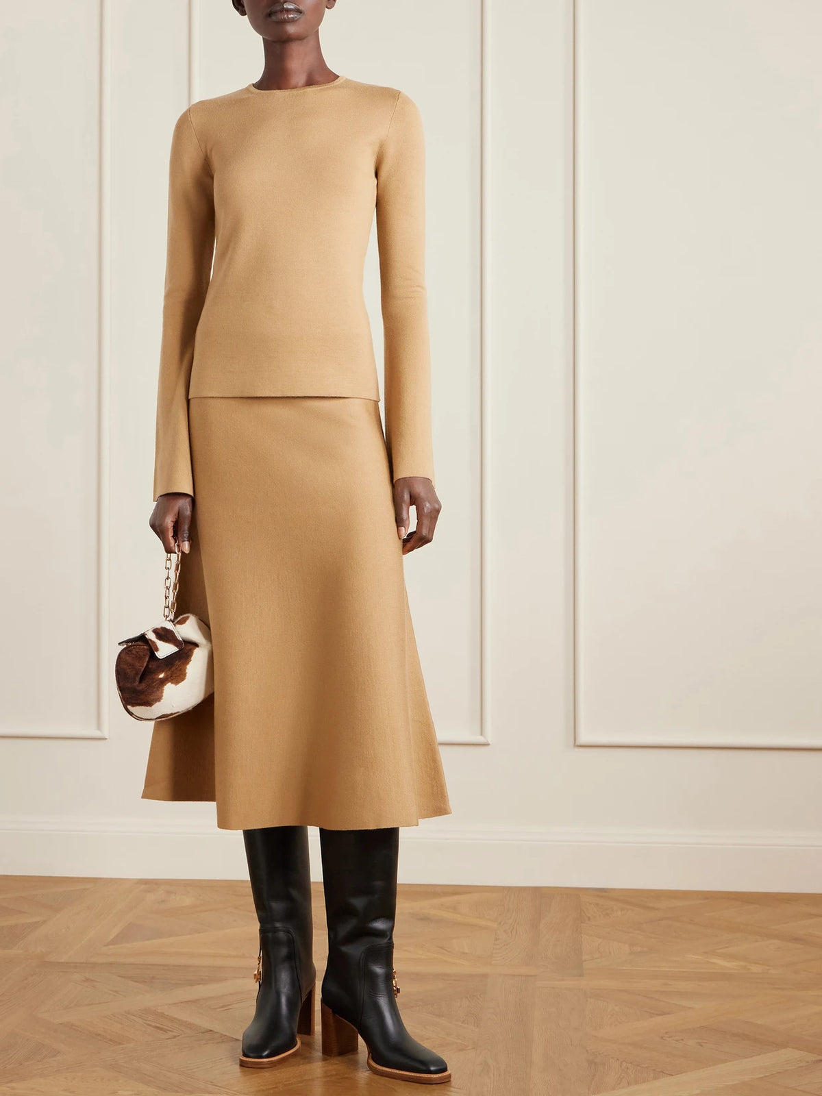 Image of Bags. Product name - Soft Demi Cow-print Calf Hair Clutch in Brown colour by brand - Gabriela Hearst