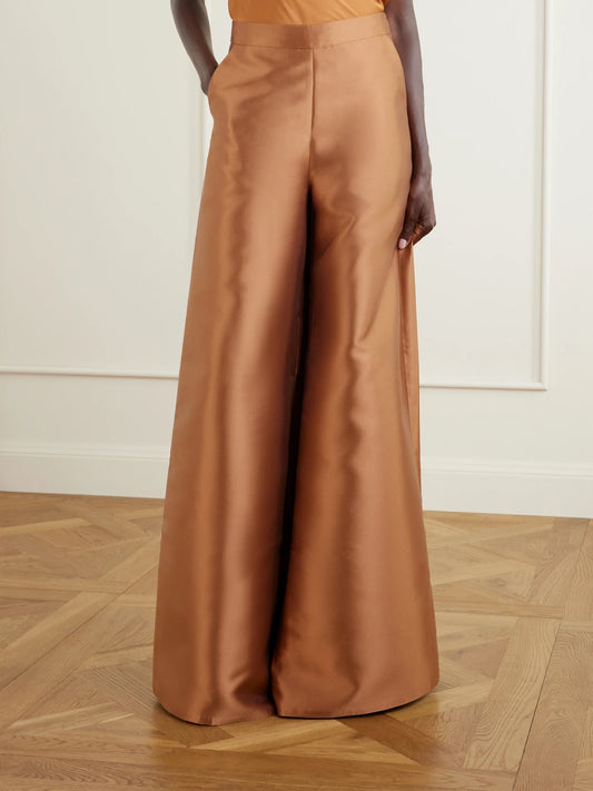 Image of a model wearing Pants. Product name - Satin-twill Wide-leg Pants in Gold colour by brand - Dima Ayad