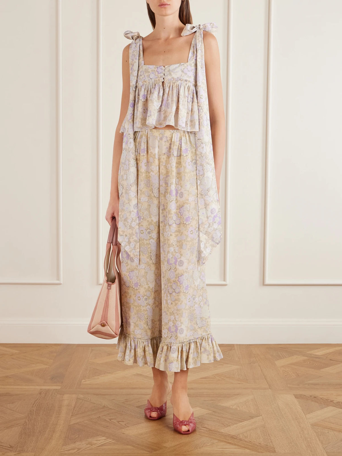 Image of a model wearing Pants. Product name - Ruffled Floral-print Silk-charmeuse Wide-leg Pants in Multi colour by brand - Chloé