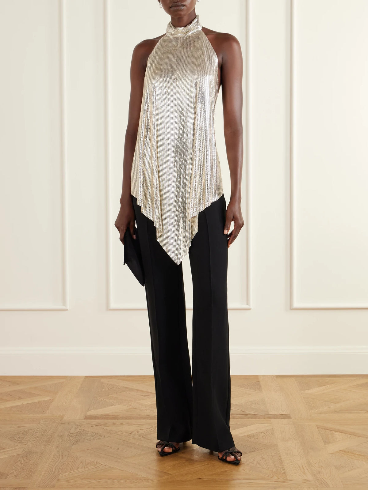 Image of a model wearing Tops. Product name - Open-back Chainmail Halterneck Blouse in Silver colour by brand - Stella McCartney